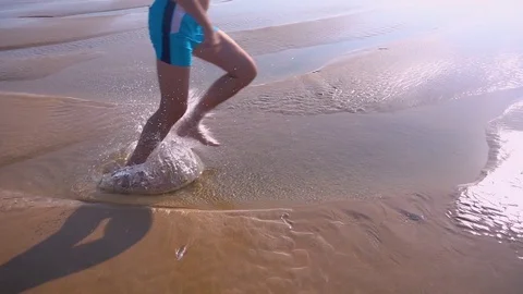 Close Up of Feet Running at the Beach Stock Footage 81791647