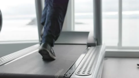 Close-up of feet running on a treadmill, running, jogging, workout, gym. 4K Stock Footage 230196765