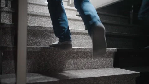Close-up of Feet in Socks Walking Up Stone Stairs. Perspective shot of a pe.. Stock Footage 331971204