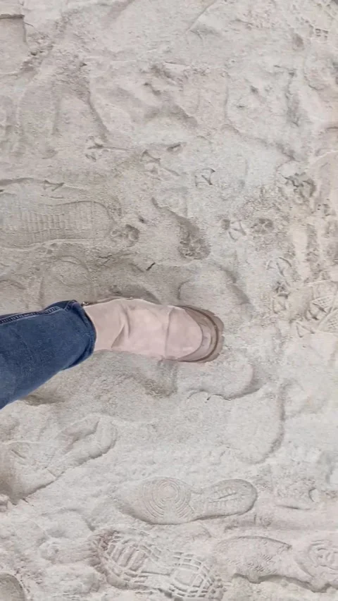 Close-up of feet walking on the sand Stock Footage 297738176