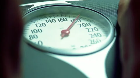 Close up of feet on weight scale Stock-Footage 46216441