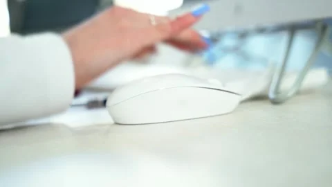 Close up of female administrator hand using mouse working on computer Technology Stock Footage 313632143
