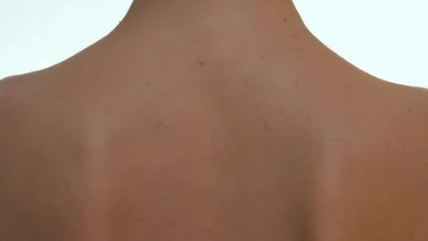Close up on female backbone over white studio background. Stock Footage 120033842