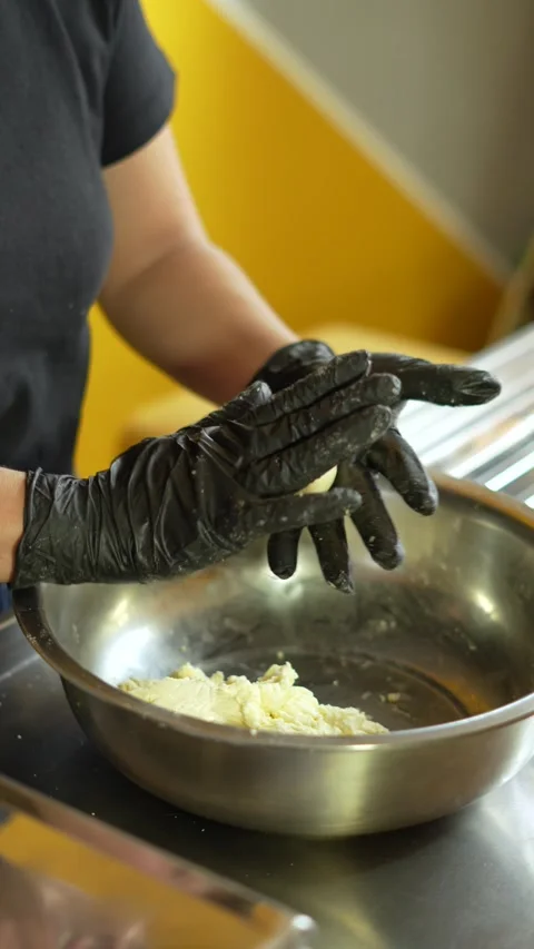 Close-up of Female Baker Shaping Dough for Cheese Bread or Bunuelos Stock Footage 285641920