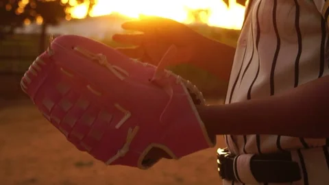 Close-up female baseball player with sunset Stock Footage 143844358