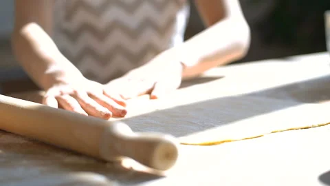 Close up. Female child hands preparing dough on the table. Stock Footage 106024311