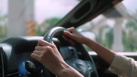 Close-up of female driver's hands on steering wheel Stock Footage 345325230