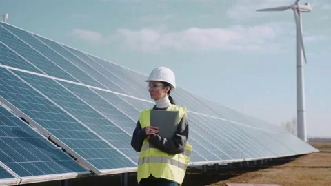 Close up of female ecological engineer checking the operation of solar panels Video stock 171969756