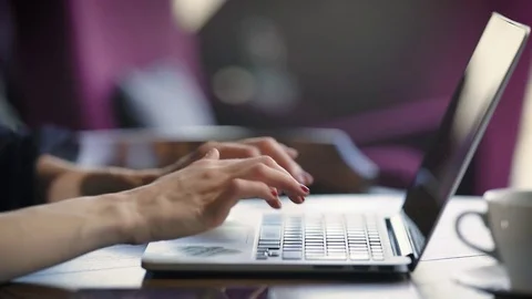 Close up of female elegant hands with red nails typing text on keyboard of Video stock 75620770