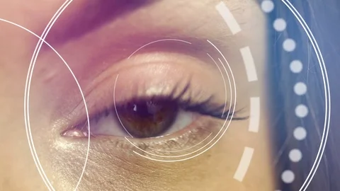 Close up of female eye checks vision in future clinic Video stock 79313361