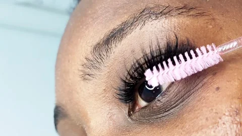 Close up of female eye with eyelash extensions in beauty salon Stock Footage 329012156