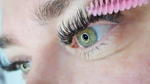 Close up of female eye with eyelash extensions ,eyelash extension procedure Stock Footage 329742783