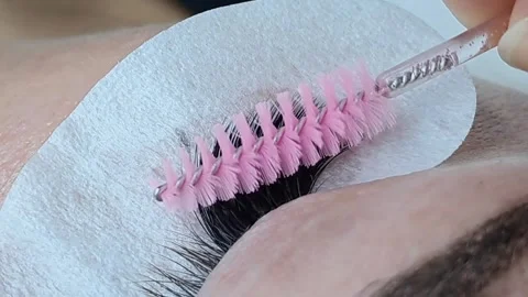 Close up of female eye with eyelash extensions ,eyelash extension procedure Stock Footage 329742795