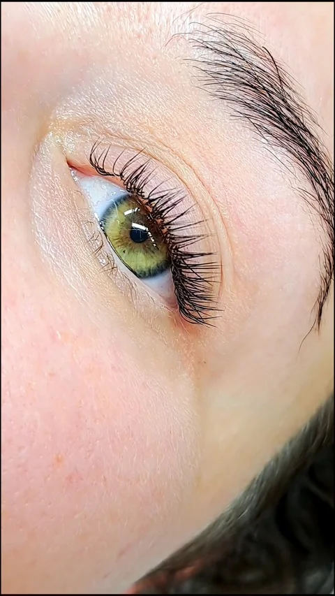 Close up of female eye with eyelash extensions ,eyelash extension procedure.2 Stock Footage 340830418