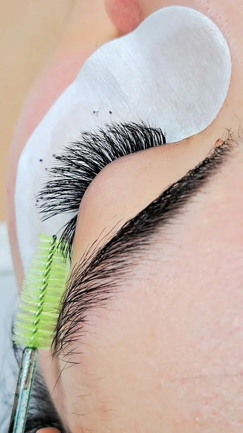 Close up of female eye with eyelash extensions ,eyelash extension procedure.2 Stock Footage 340830424