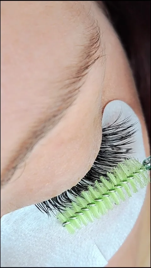 Close up of female eye with eyelash extensions ,eyelash extension procedure.2 Stock Footage 340830429