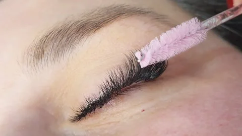 Close up of female eye with long eyelash extensions ,beauty salon treatment Stock Footage 319675202