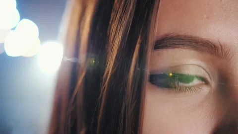 Close up of female eye looking at camera under cinematic lighting Vídeo Stock 337504338