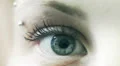 close-up of female eye looks around - move - open - close - macro HD Footage
