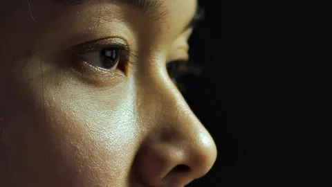 Close-up of female eyes looking forward and moving as if reading Stock Footage 222969745