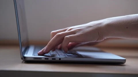 Close up of Female Finger using a laptop, typing, browsing the internet Stock Footage 251457352
