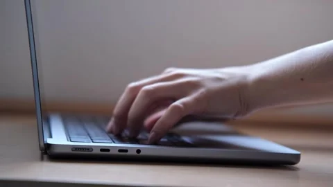 Close up of Female Finger using a laptop, typing, browsing the internet Stock Footage 251784130