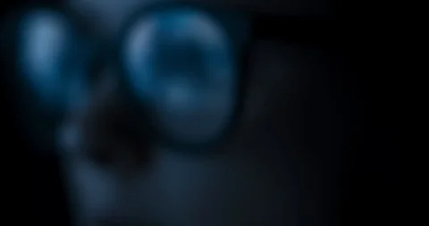 Close-up female in glasses reflecting computer game Video stock 98688518