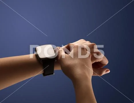 Close up female hand with balck smartwatch screen Stock Photos