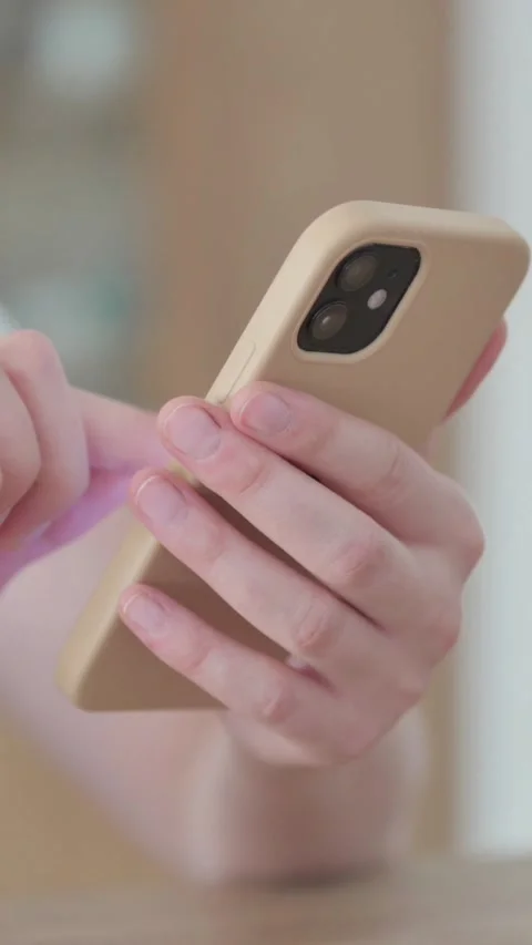 Close up of Female Hand Browsing Internet on Smartphone, Vertical Video 스톡 동영상 328967907