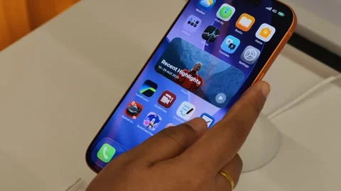 Close-Up Female Hand Browsing Latest iPhone Interface in Smooth 4K Slow Motion Stock Footage 321067045
