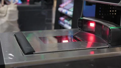 Close up of female hand checking out her purchases at the cash register Video stock 140990682