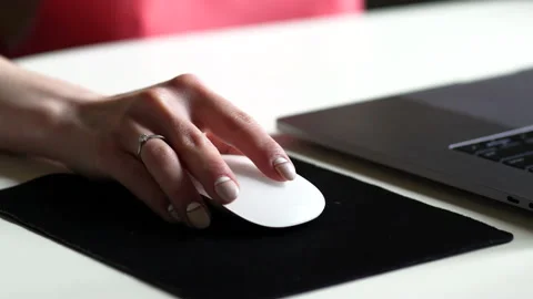 Close-up. Female hand on a computer mouse 스톡 동영상 165514406