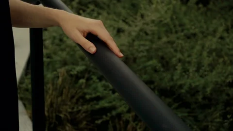 Close-up of a female hand going down the pipe Stock Footage 136838477