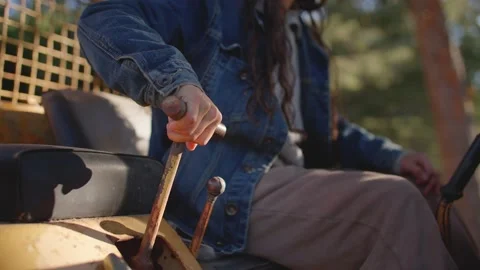 Close up of female hand grabbing machine lever, tractor 库存影片 213487490