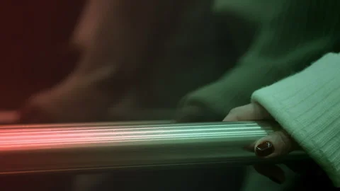 Close up of female hand inside of modern transparent glass elevator moving up Stock Footage 255558766