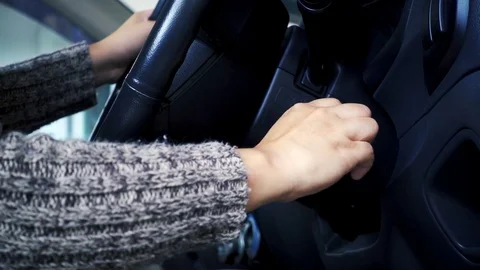 Close up of female hand key is put into the ignition and starts the car Stock Footage 78508088