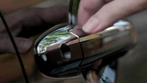 Close up of female hand opening or closing a car door Stock Footage
