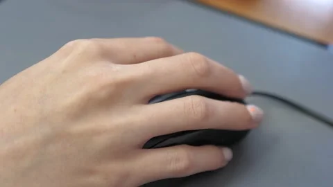Close up of a female hand operating computer mouse, at home, in office 스톡 동영상 148522516