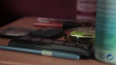 Close Up of Female Hand Picking Up Makeup Palette from Dressing Table 動画素材 341470002