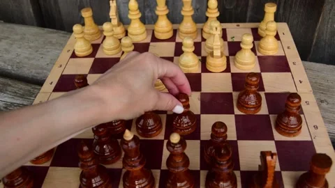Close-up of a female hand playing chess, for the development strategy analysis. Stock Footage 205846760
