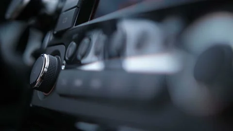 Close-up. Female hand presses the control buttons of radio stations in the car Stock-Footage 100397979