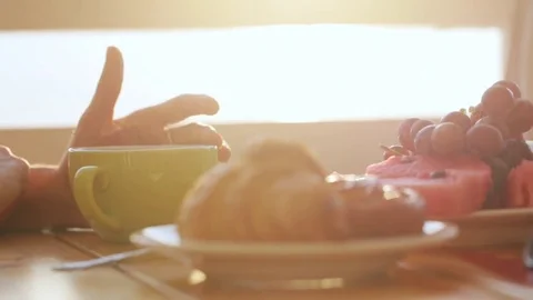 Close-up female hand stroking the cup of tea in open air cafe. Stock Footage 79827047
