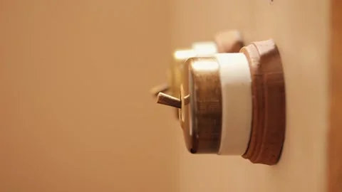 Close-Up Female Hand Turning On Light In Cozy Warm Hotel or Country House Room Видео 281817050