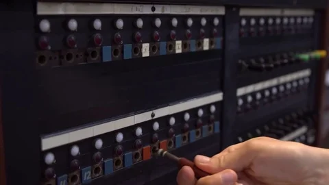 Close-up of female hand using 30-line teleprinter switchboard. Stock Footage 77712032