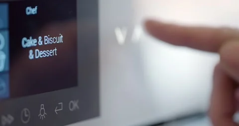 Close up female hand using microwave for cooking dinner in kitchen Stock Footage 147399057