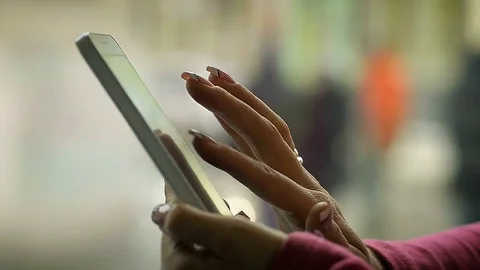 Close-Up of a Female Hand Using a Smart Phone in the Cafe Near the Window Stock Footage 74636437