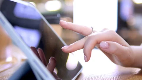 Close-up of female hand using tablet 库存影片 340915812