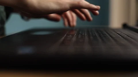 Close-up of female hand using touchpad and typing text on laptop keyboard with 스톡 동영상 94772606