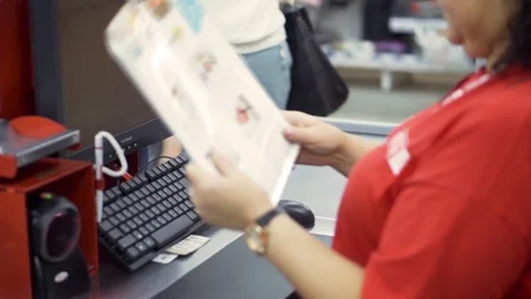 Close up of female hands with bar code scanner scanning a toy good for children Stock Footage 122201144