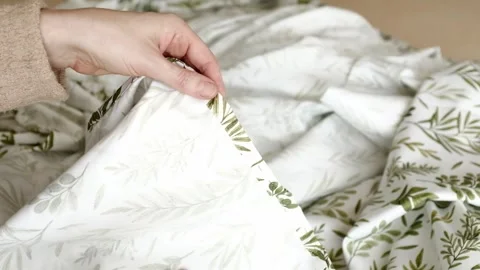 Close up of female hands carefully assembles cotton fabric with needle pins. Stock Footage 316920537